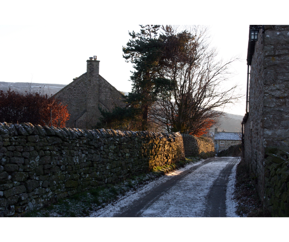 A narrow, rural street in North Yorkshire, with ice on the ground