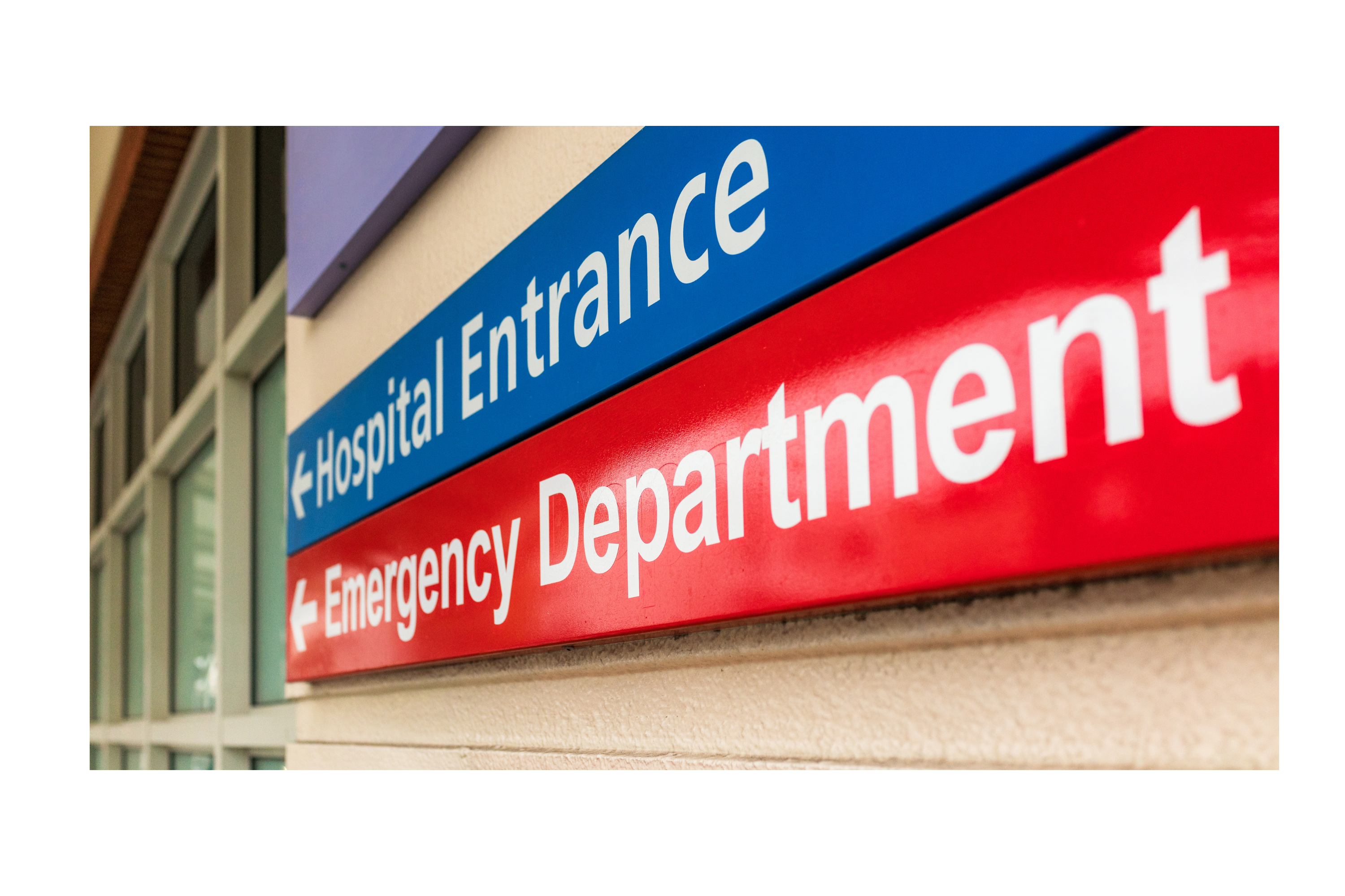 A sign with the words 'Hospital entrance' and underneath it the words 'Emergency department'. Both are pointing in the direction of left.