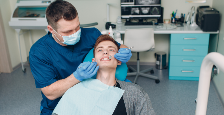 A dentist performing a check-up on a patient.