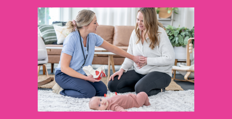 Healthcare professional sat with a mother and baby
