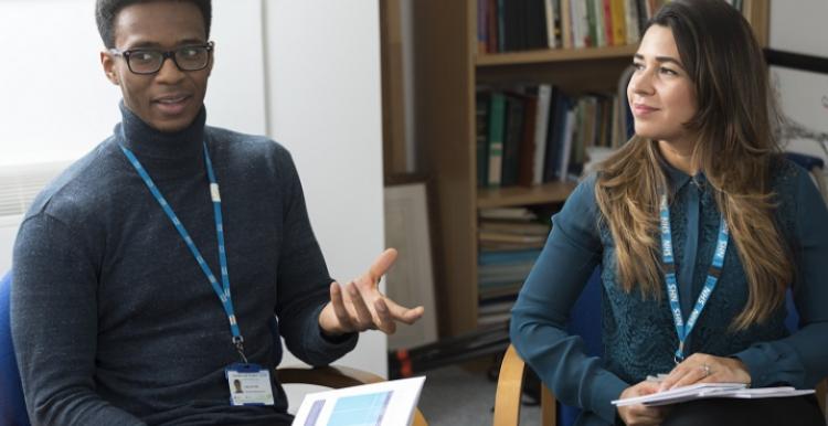 Mental health and well-being practitioners sat down and talking to each other