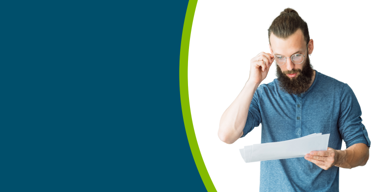 A young adult man reading some information in an accessible format.
