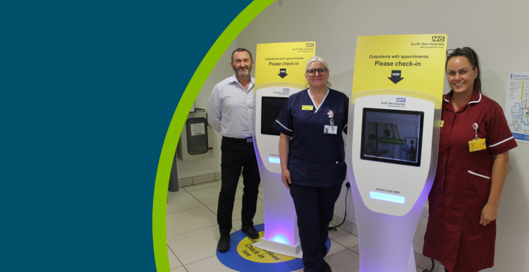 Staff at South Tees Hospitals NHS Foundation Trust with the self check-in kiosks