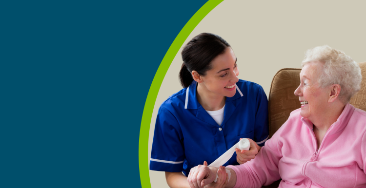 An older woman in a care home with a nurse putting a bandage on her wrist