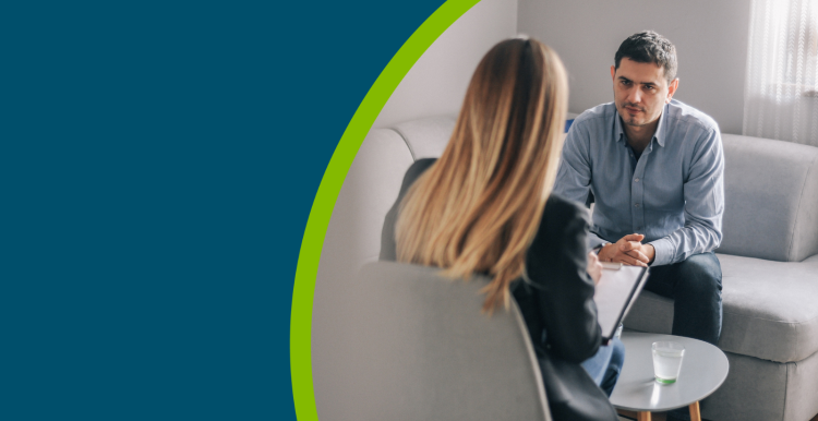 Middle-age man having one-on-one counselling with a therapist.