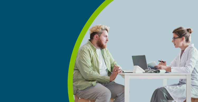 Overweight man sitting at the table together with doctor and talking about his health during his visit.