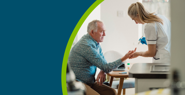 Senior diabetic man is having a check up at home from a district nurse. She is checking his blood glucose levels.