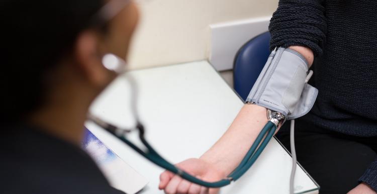 person at the doctors having blood pressure monitored