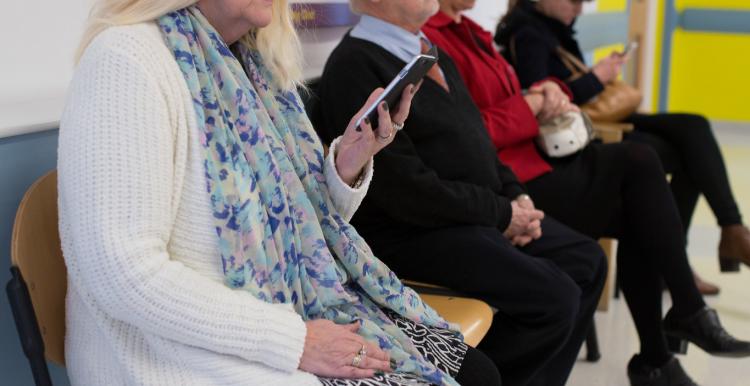 people sat in waiting room