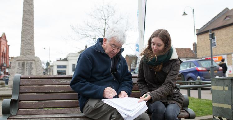 two people sat on bench at healthwatch event