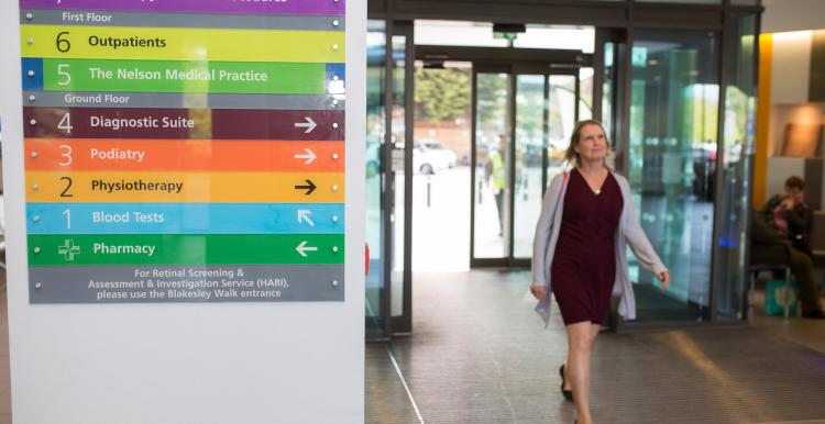 woman walking in to hospital