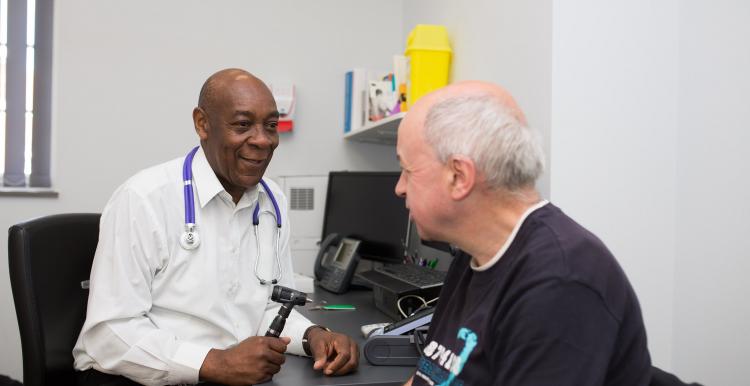 man in room with doctor