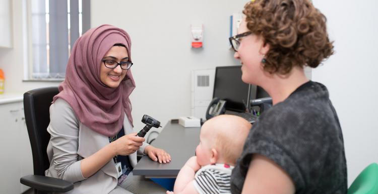 doctor with mum and baby 