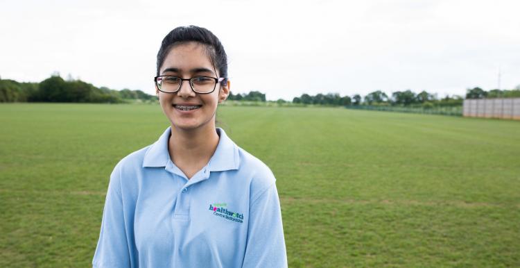 Young volunteer smiling at the camera