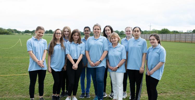 Group of young volunteers smiling at the camera