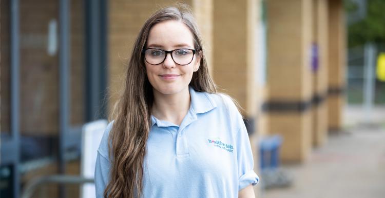 Young volunteer smiling at the camera