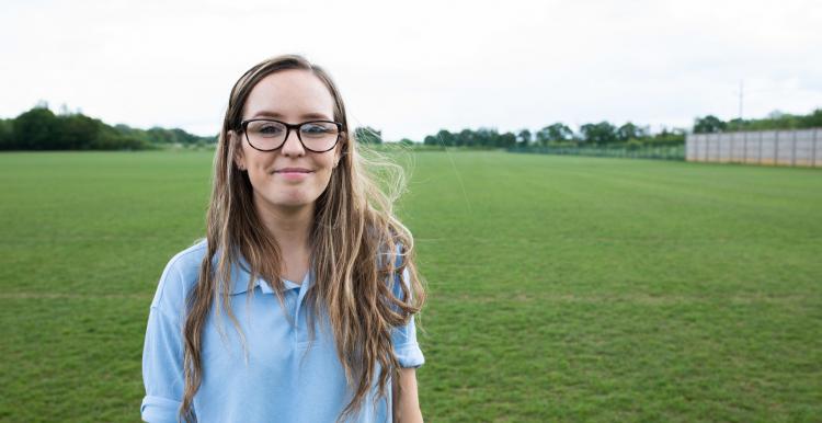 Young volunteer smiling at the camera