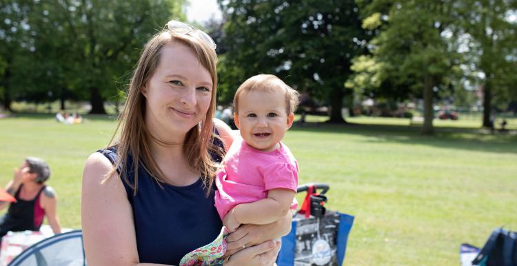 Mother holding her infant child