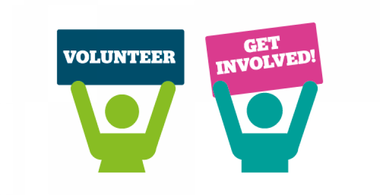 Volunteers holding banner