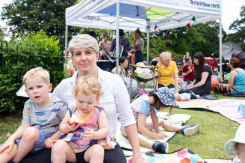 A mother and baby at a community event