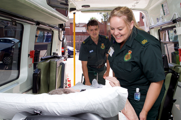 Patient transport service staff with a patient.