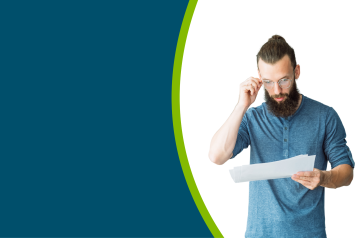 A young adult man reading some information in an accessible format.