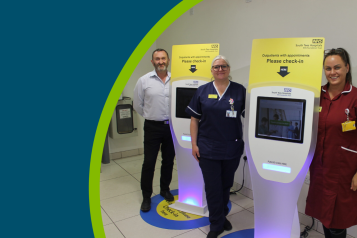 Staff at South Tees Hospitals NHS Foundation Trust with the self check-in kiosks