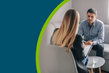 Middle-age man having one-on-one counselling with a therapist.
