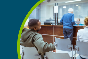 Rear view of people in a hospital waiting room