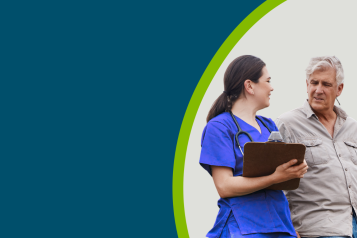 A healthcare professional with a clipboard talking with a farmer patient
