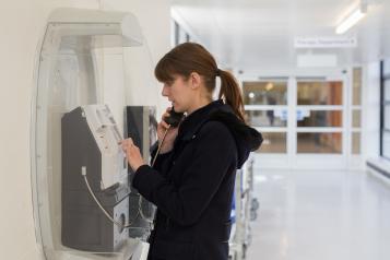 person using telephone in hospital