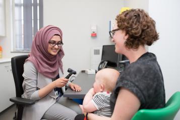 doctor with mum and baby