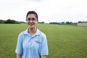 Young volunteer smiling at the camera