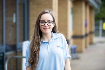 Young volunteer smiling at the camera