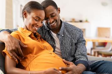 Expectant mother and father holding her tummy in readiness for a new baby