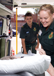 Patient transport service staff with a patient.